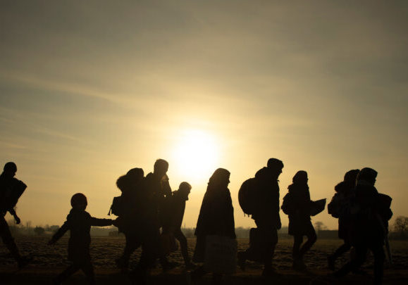 Migrants,Walk,Towards,The,Turkey's,Pazarkule,Border,Crossing,With,Greece's